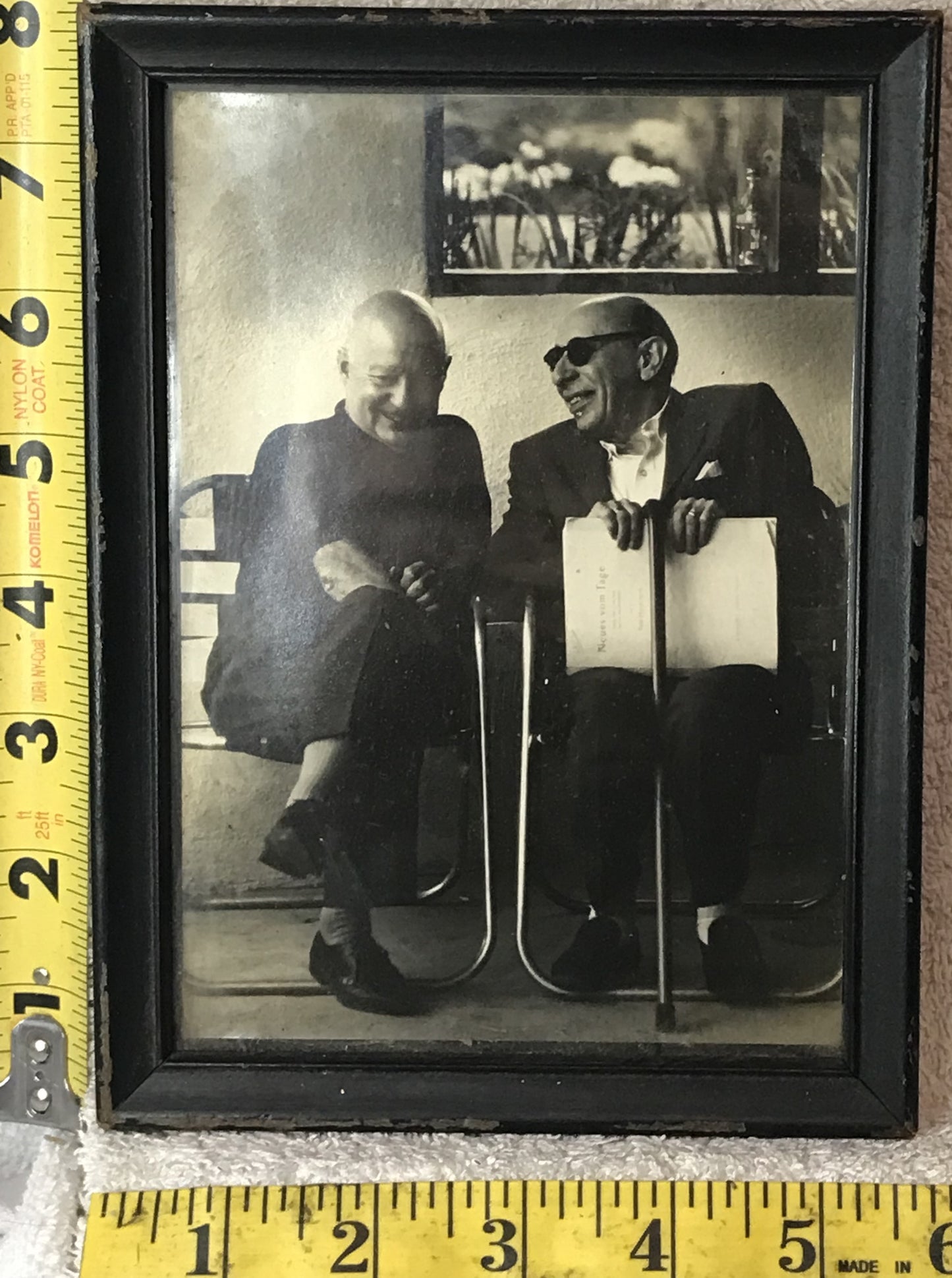 Vintage Black and White Photograph of Two Men in Conversation